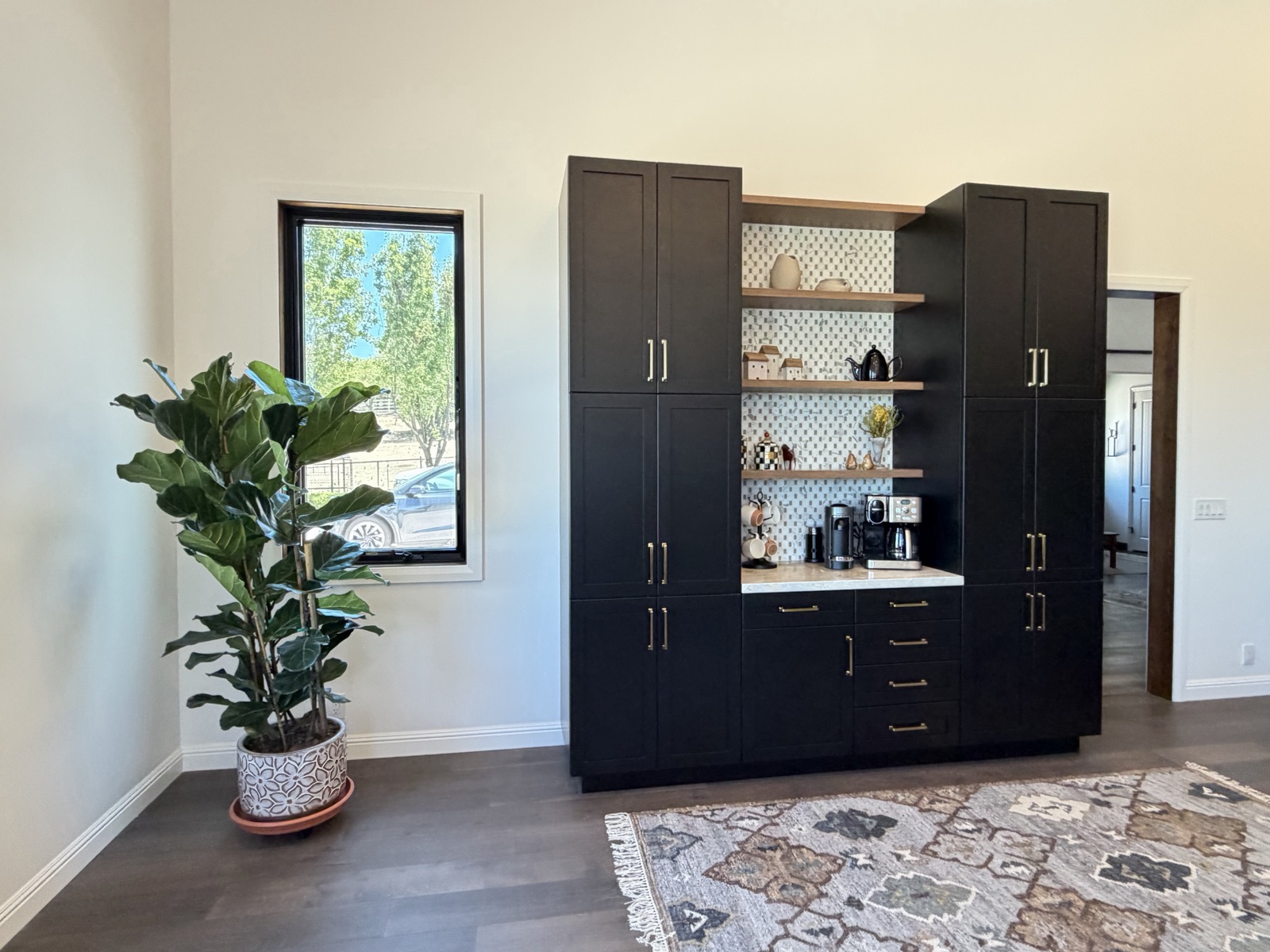 Hollister home addition - custom coffee bar with floating white oak shelves and pantry towers